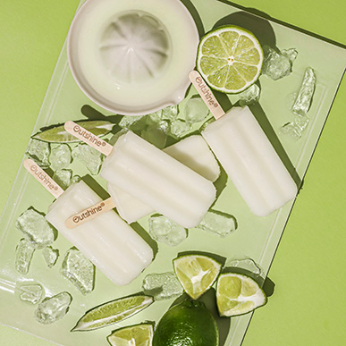 Outshine lime bars with fresh lime slices