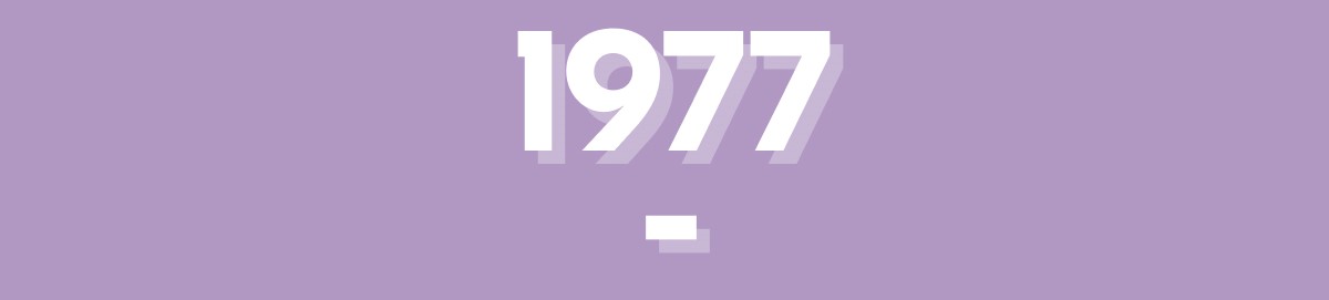 The year 1977 on a purple background