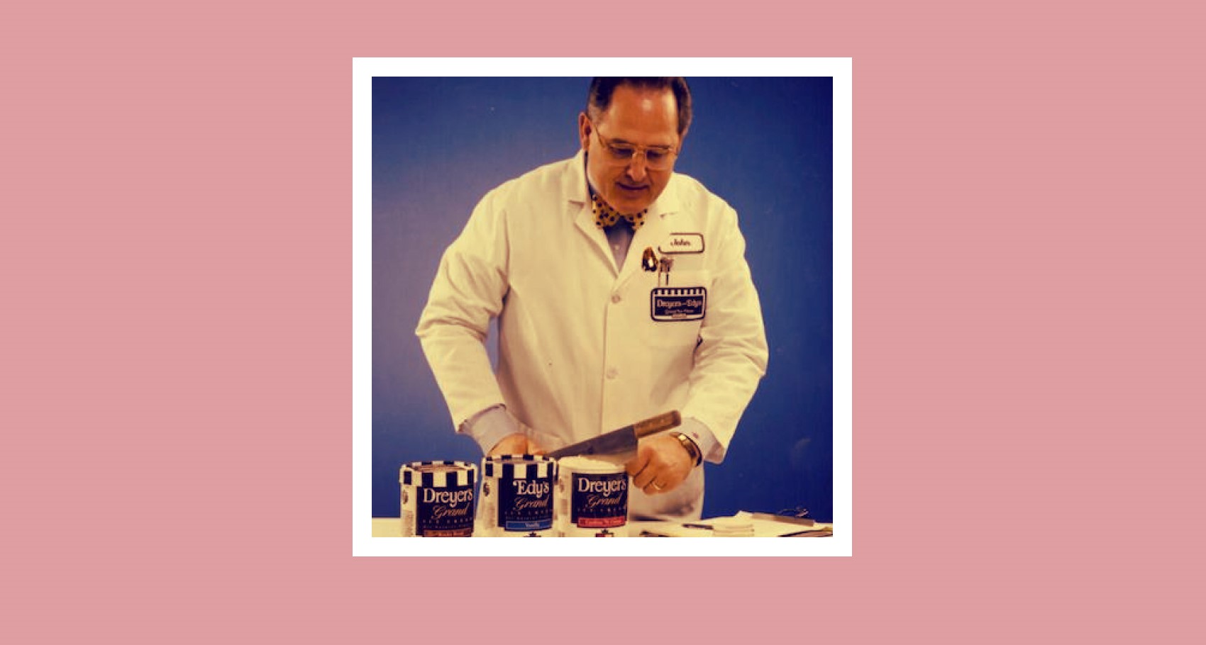 Man from 1982 slicing one open Dreyer's ice cream with a large knife