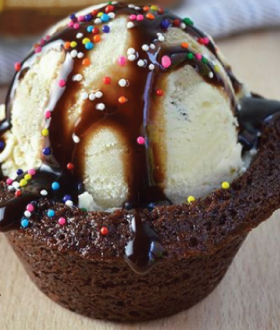 Brownie as a bowl with a scoop of ice cream and chocolate sauce
