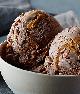 Scoops of Haagen-Dazs chocolate peanut butter ice cream in a bowl
