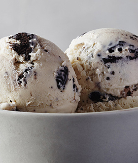 Scoops of Haagen-Dazs cookie and cream ice cream in a bowl