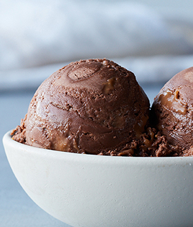 Scoops of Haagen-Dazs heaven chocolate sea salt caramel ice cream in a bowl