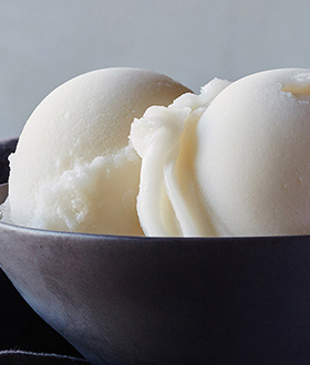 Scoops of Haagen-Dazs lemon sorbet in a bowl