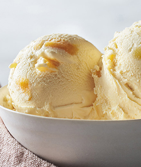 Scoops of Haagen-Dazs mango ice cream in a bowl