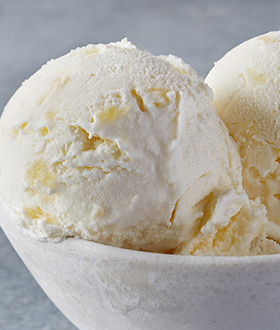Scoops of Haagen-Dazs pineapple coconut ice cream in a bowl