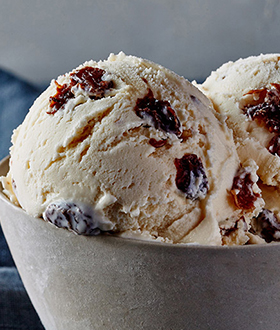 Scoops of Haagen-Dazs rum raisin ice cream in a bow