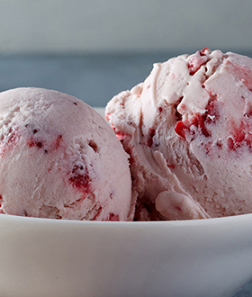 Scoops of Haagen-Dazs strawberry ice cream in a bowl