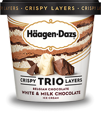 Pint of Haagen Dazs crispy trio layers Belgian chocolate, white & milk chocolate ice cream in retail packaging.