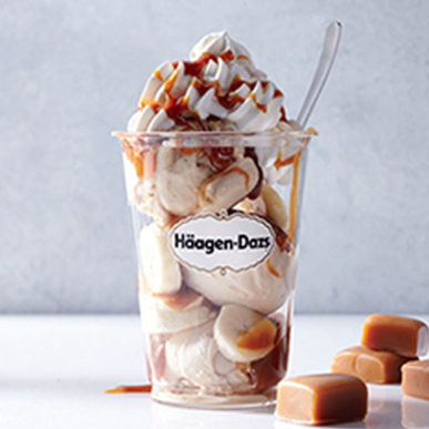 Haagen-Dazs cup with bananas, ice cream, whipped cream and syrup