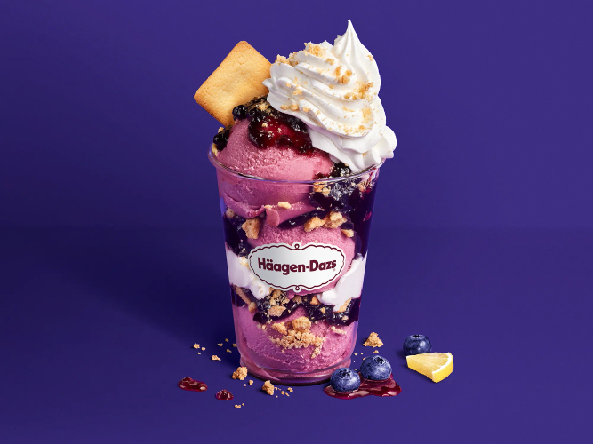 Blueberry Lemon Crumble Dazzler Summer Blueberry & Lemon Sorbet layered with short bread cookies and blueberry preserves, topped with whipped cream, cookie crumbles and garnished with a short bread cookie.