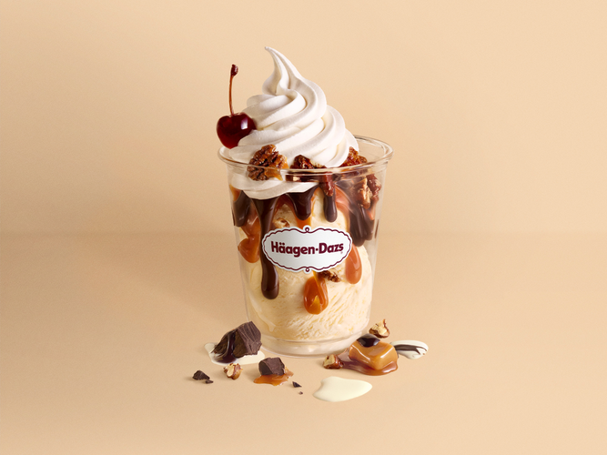 Hot Fudge & Caramel Sundae Vanilla Ice Cream with hot fudge, warm caramel, and candied pecans, topped with whipped cream and a premium cocktail cherry from Traverse City Whiskey Co. - slow cooked, candied Michigan cherries known for their bold tart-sweet flavor.