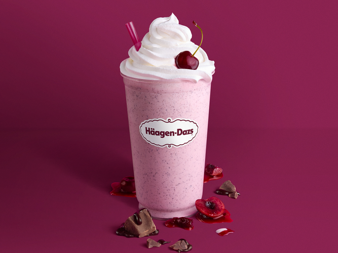 Dark Cherry Truffle Shake Dark Cherry Truffle Ice Cream specked with chocolate and sweet cherries blended with milk and topped with whipped cream and garnished with a dark cocktail cherry.