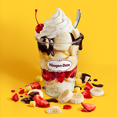 Banana Split Dazzler with strawberries, whipped cream, and a cherry on top