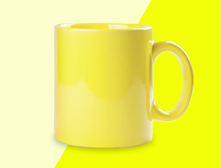 yellow coffee mug on yellow background