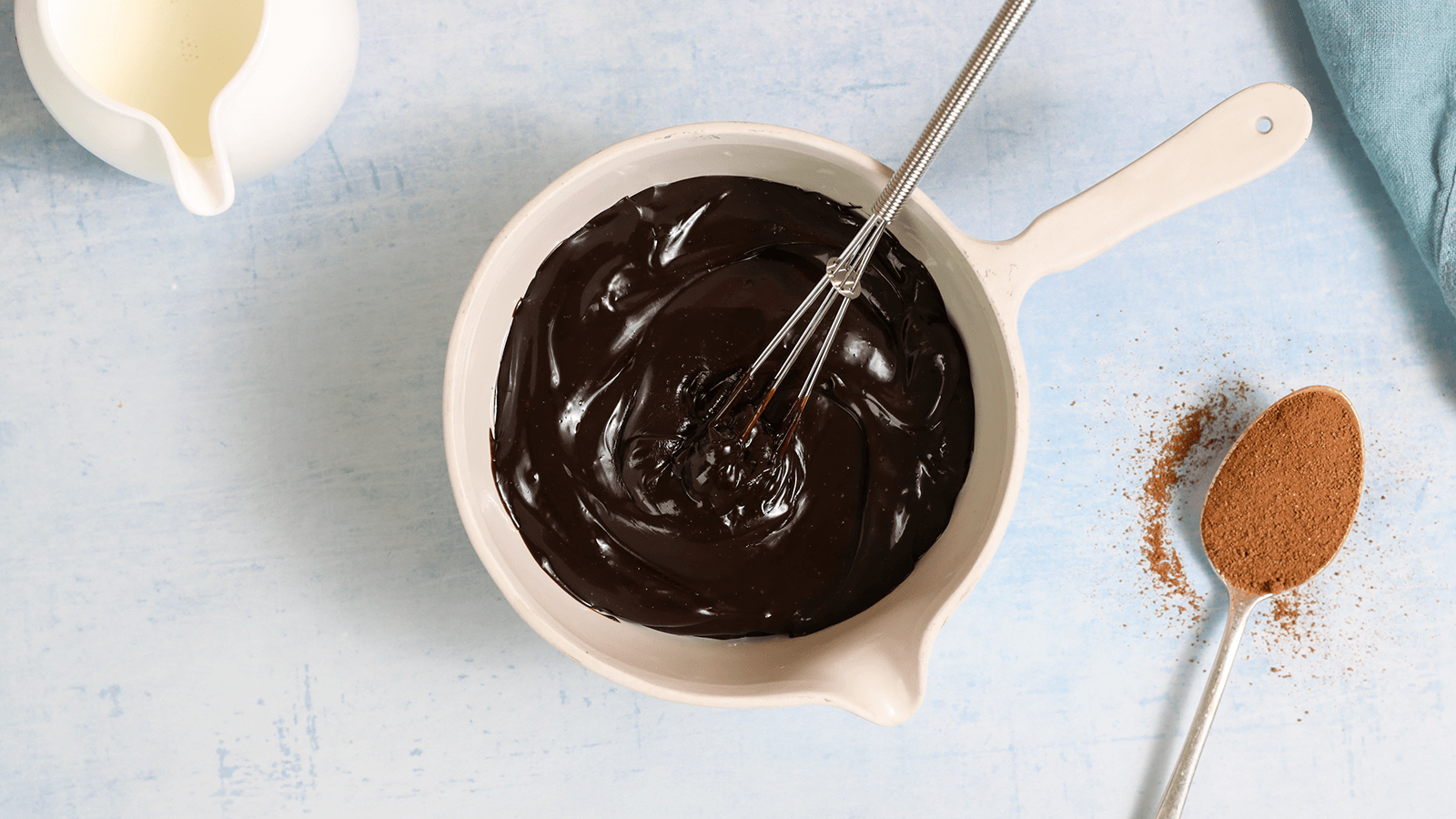 brownie batter and whisk in white bowl