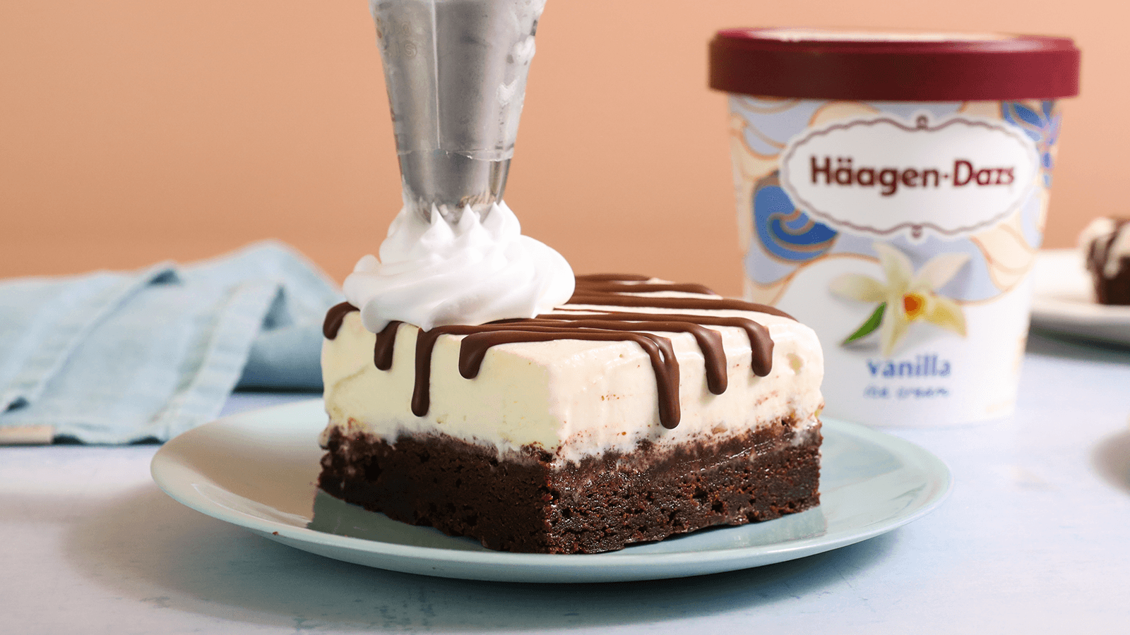 vanilla ice cream brownie bar with whipped cream
