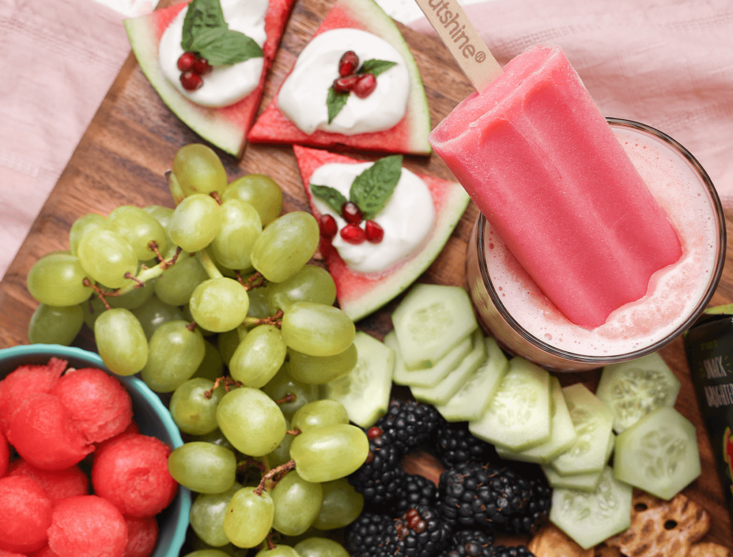 Outshine watermelon bar with a smoothie and other snacks