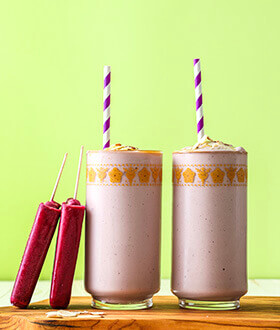 Outshine grape almond butter smoothie with a straw